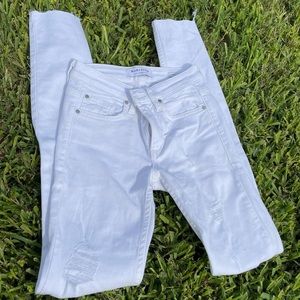 white semi ripped white jeans